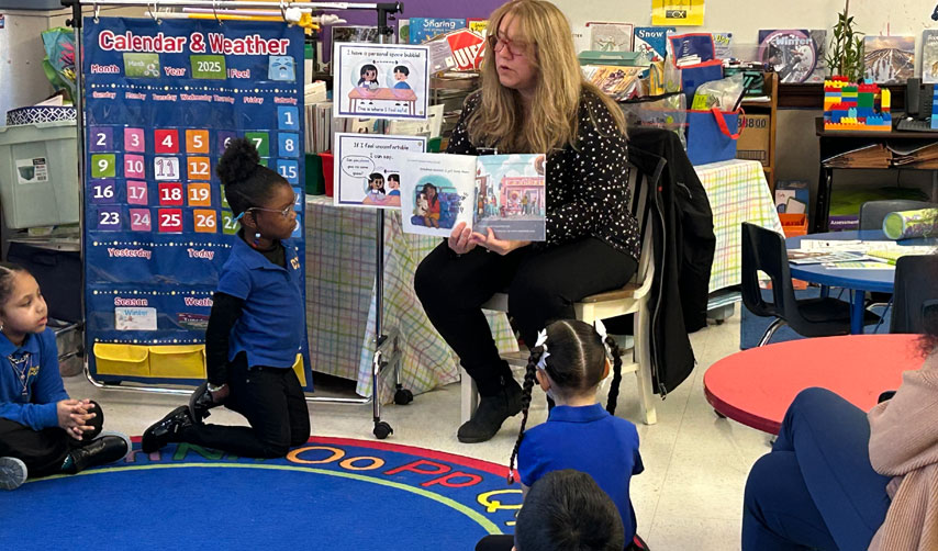 Lisa reading to school children